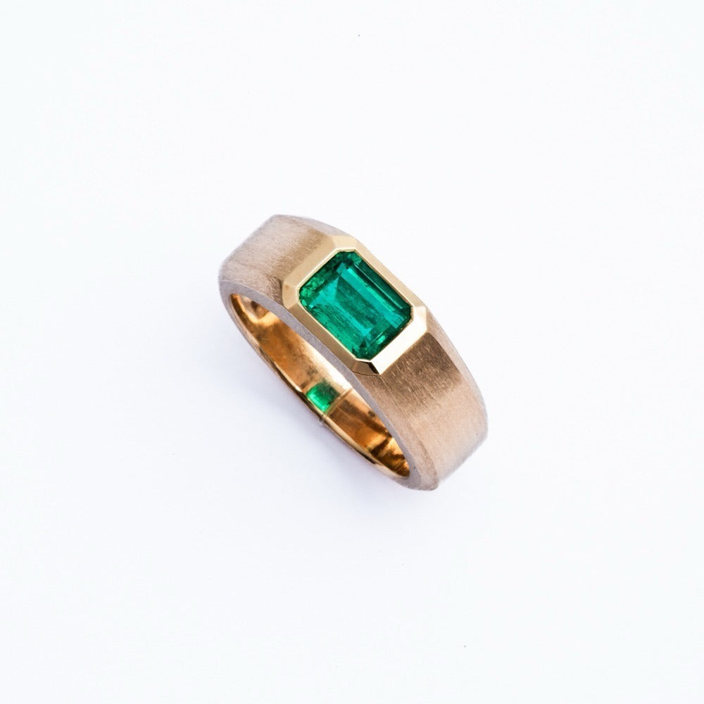 The Muzo. A 1.64 carat Colombian emerald bezel-set in brushed 18K yellow gold.